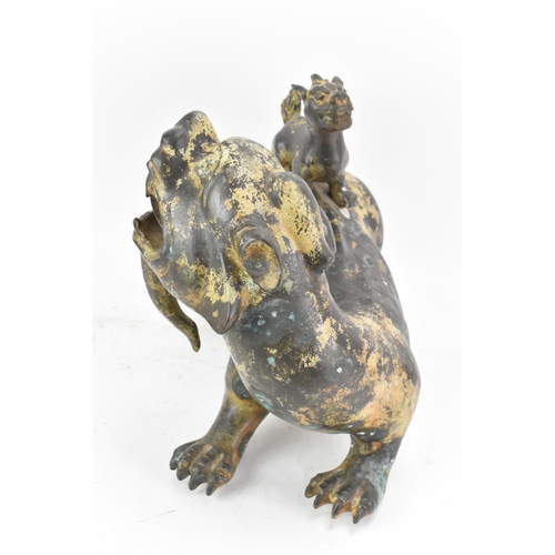 195 - A Chinese large bronzed pottery sculpture of a standing temple foo dog with a pup standing on its ba... 