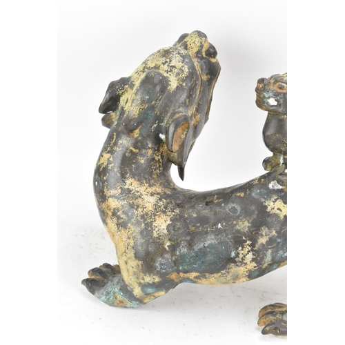 195 - A Chinese large bronzed pottery sculpture of a standing temple foo dog with a pup standing on its ba... 