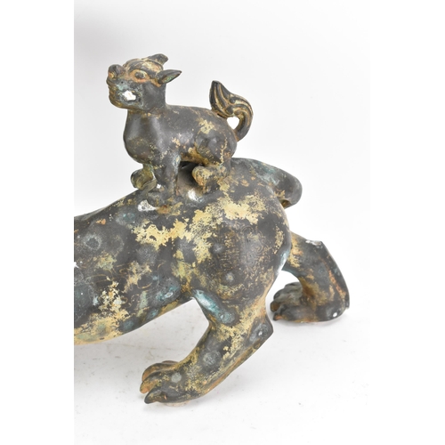 195 - A Chinese large bronzed pottery sculpture of a standing temple foo dog with a pup standing on its ba... 