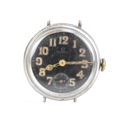 29 - An Omega World War (WWI) manual wind, gents wristwatch, the black dial having Arabic numerals with a... 