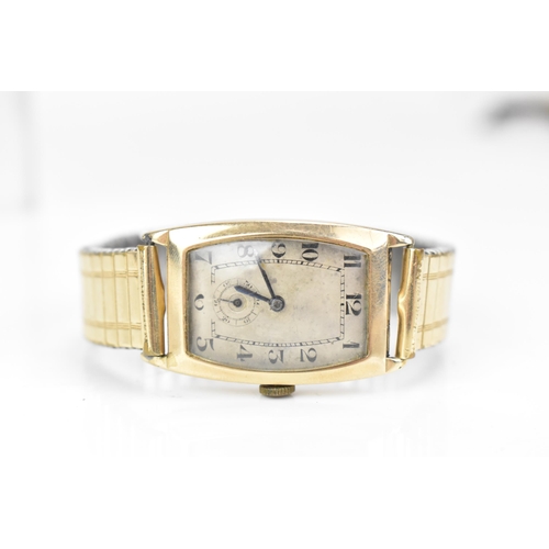 32 - An Art Deco, manual wind, gents, 9ct gold wristwatch, the silvered dial having Arabic numerals, subs... 