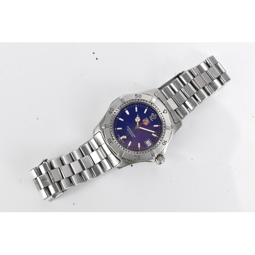 35 - A Tag Heuer Professional 200m, quartz, gents, stainless steel wristwatch, having a blue dial with ba... 