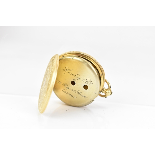 39 - A late 19th century 18ct gold, open face fob watch, the gilt dial engine turned with a floral centre... 