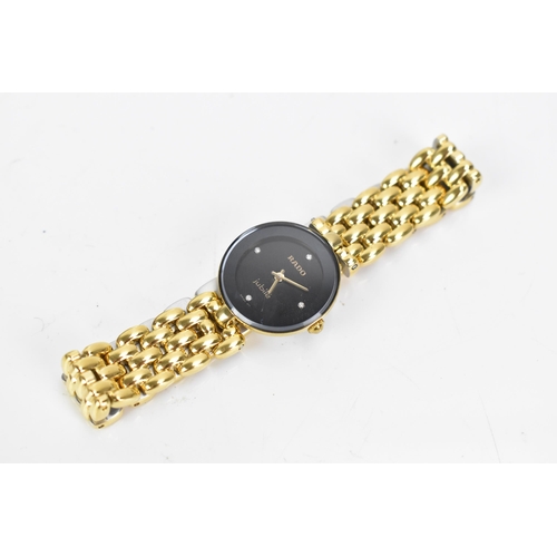 42 - A Rado Jubile, quartz, ladies, gold plated wristwatch, the black dial having diamond quarter markers... 