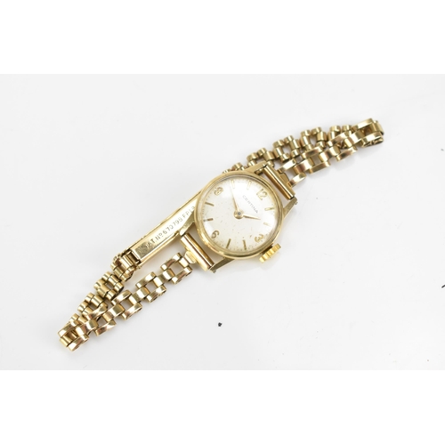 43 - A Certina, manual wind, ladies, 9ct gold wristwatch, having a silvered dial with baton markers and A... 