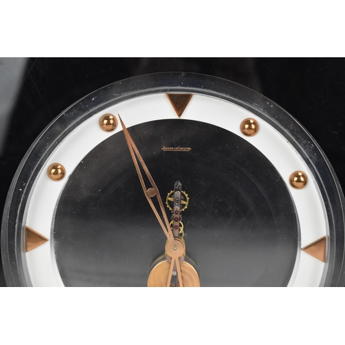 54 - A 1960's Jaeger LeCoultre floating skeleton clock, having a perspex case with visible 8-day movement... 