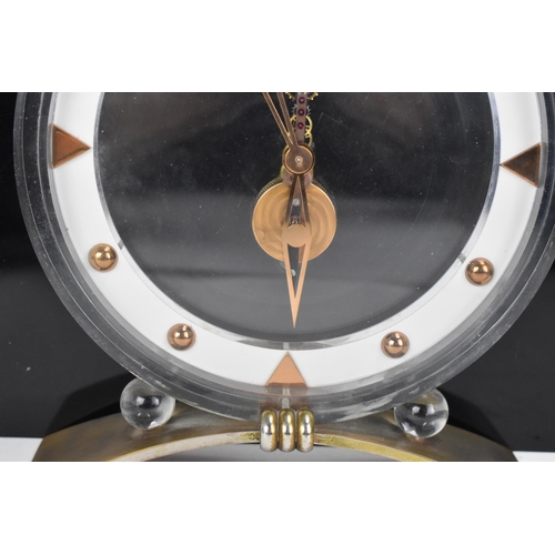 54 - A 1960's Jaeger LeCoultre floating skeleton clock, having a perspex case with visible 8-day movement... 