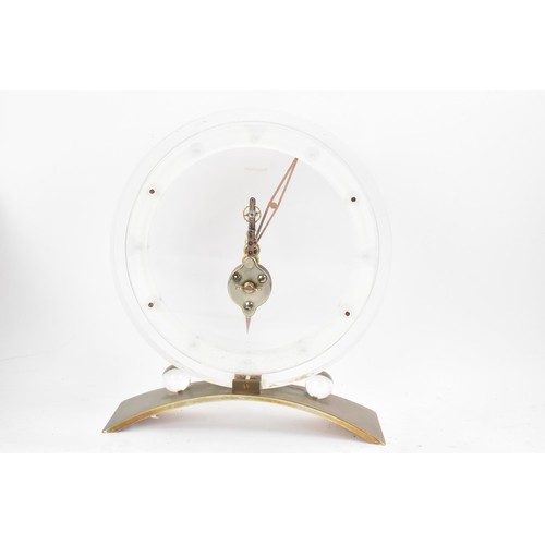 54 - A 1960's Jaeger LeCoultre floating skeleton clock, having a perspex case with visible 8-day movement... 