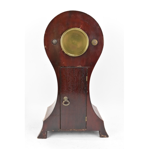 56 - An early 20th century Eureka electric mahogany cased mantle clock, the enamel dial having Arabic num... 