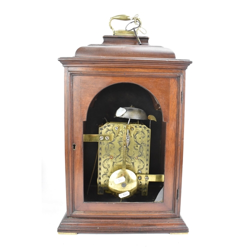 57 - A mid 18th century mahogany bracket clock by Conyers Dunlop, London. The case having a bell top with... 