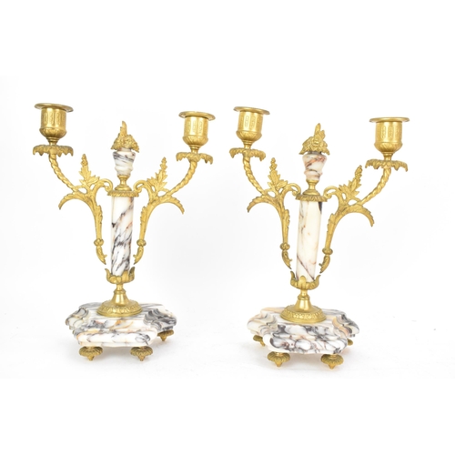 58 - A late 19th century French marble and gilt metal clock garniture, the clock or architectural form wi... 