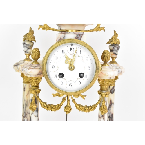 58 - A late 19th century French marble and gilt metal clock garniture, the clock or architectural form wi... 