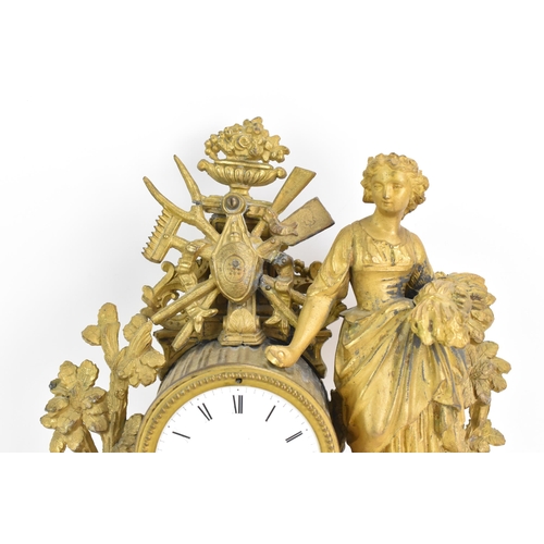 59 - A late 19th century French spelter mantle clock, the gilded case fashioned as a shepherdess leaning ... 