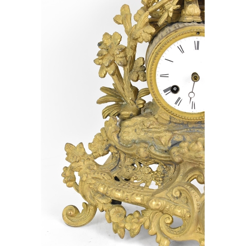 59 - A late 19th century French spelter mantle clock, the gilded case fashioned as a shepherdess leaning ... 