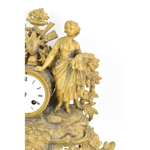 59 - A late 19th century French spelter mantle clock, the gilded case fashioned as a shepherdess leaning ... 