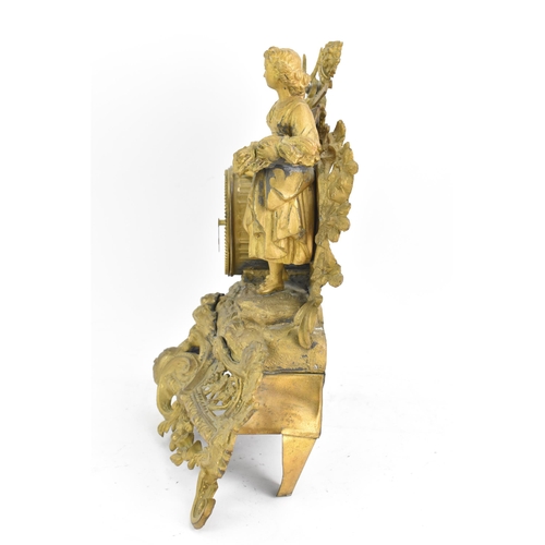 59 - A late 19th century French spelter mantle clock, the gilded case fashioned as a shepherdess leaning ... 