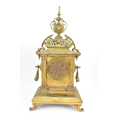 60 - A late 19th century French gilt metal 8 day mantle clock with two spelter figural garnitures, the cl... 