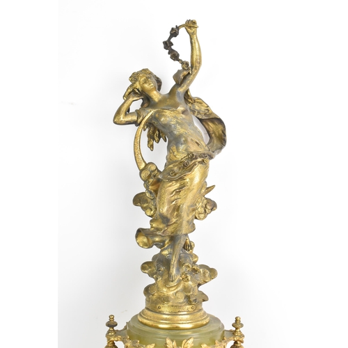 62 - A late 19th century French spelter and onyx mantle clock, mounted with a classical maiden above ribb... 