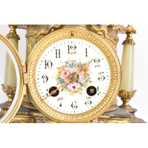 62 - A late 19th century French spelter and onyx mantle clock, mounted with a classical maiden above ribb... 