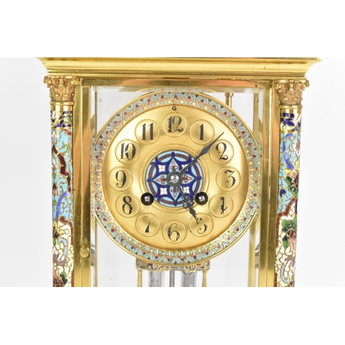 63 - A circa 1900 French gilt metal and cloisonne mantle clock, having a twin scroll handled urn formed f... 