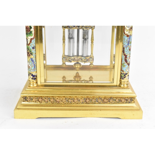 63 - A circa 1900 French gilt metal and cloisonne mantle clock, having a twin scroll handled urn formed f... 