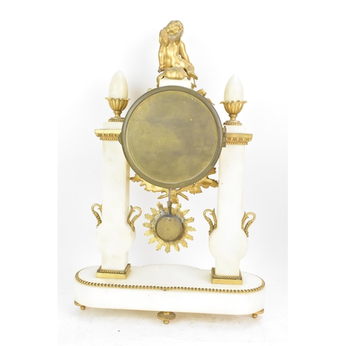 64 - A late 19th century French gilt metal and white marble portico clock and two garnitures, the clock h... 