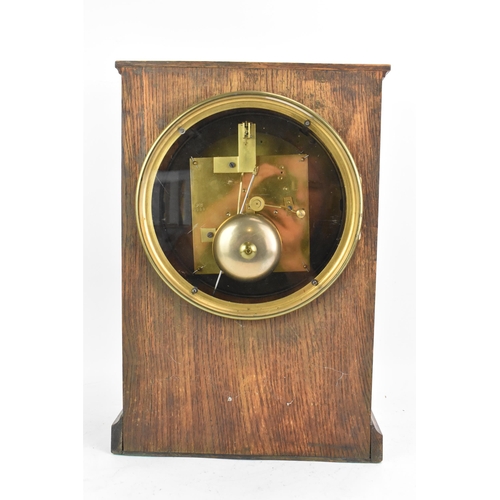 68 - A late 19th century oak cased mantle clock, the white enamel dial having Roman numerals, Breguet sty... 