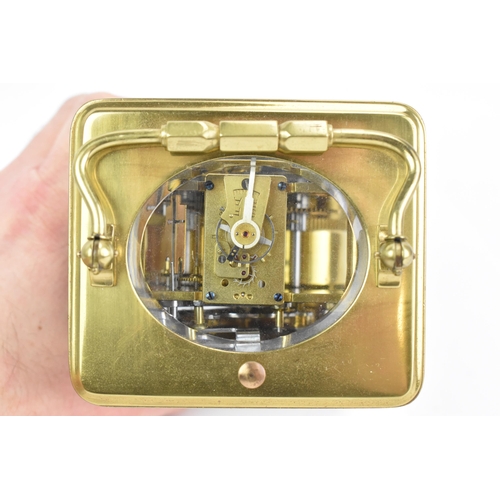 71 - An early 20th century repeating brass cased carriage clock, having a white enamel roman dial, repeat... 