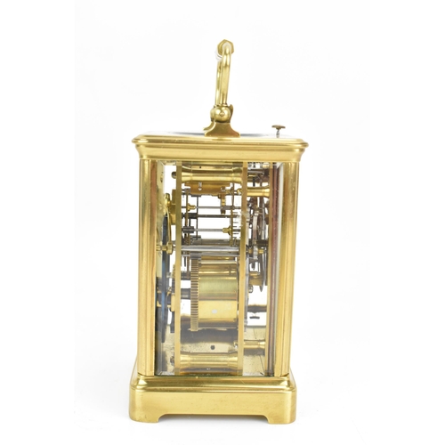 71 - An early 20th century repeating brass cased carriage clock, having a white enamel roman dial, repeat... 