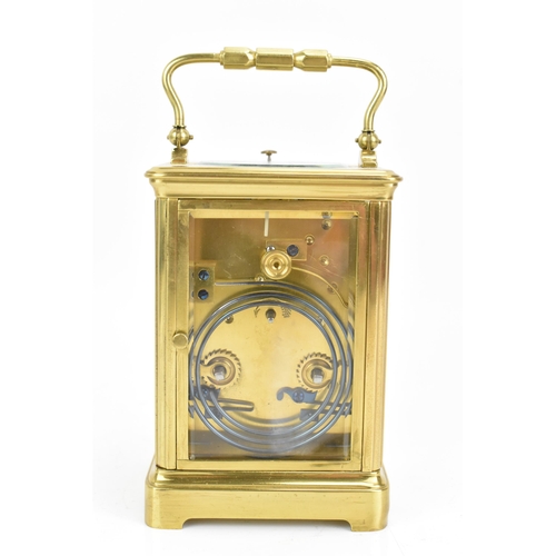 71 - An early 20th century repeating brass cased carriage clock, having a white enamel roman dial, repeat... 