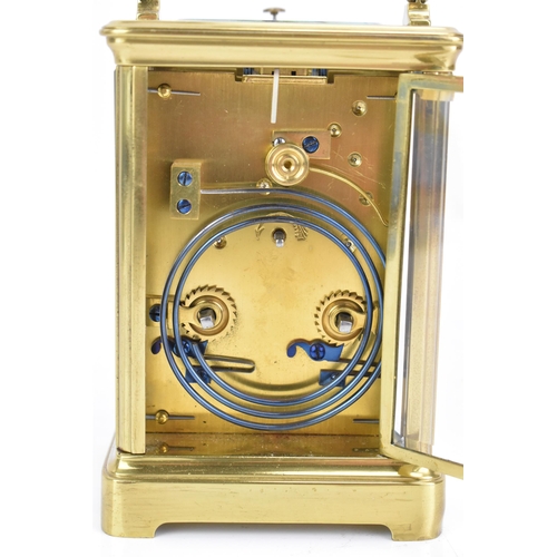 71 - An early 20th century repeating brass cased carriage clock, having a white enamel roman dial, repeat... 