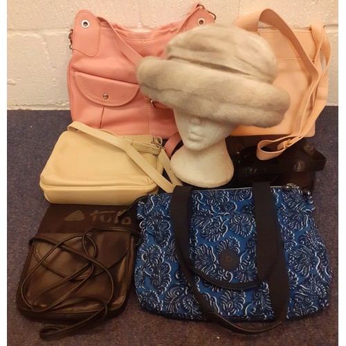 67 - A group of fashion bags to include a pink Radley crossover bag, a blue and black Kipling bag, a pink... 