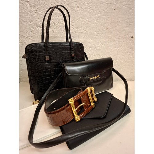 70 - A group of vintage leather bags to include a black faux snakeskin handbag, an Italian black leather ... 