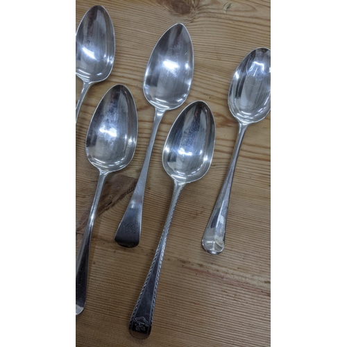 107 - A group of six English silver table spoons to include one example dated London 1814, together with o... 