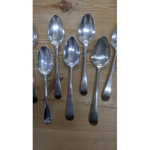 108 - A group of 7 English silver table spoons to include one example made by Smith and Fern London 1792 t... 