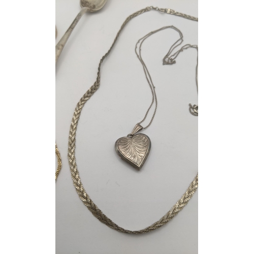 111 - A mixed lot to include a silver teaspoon, two silver necklaces and a gold plated bangle, together wi... 