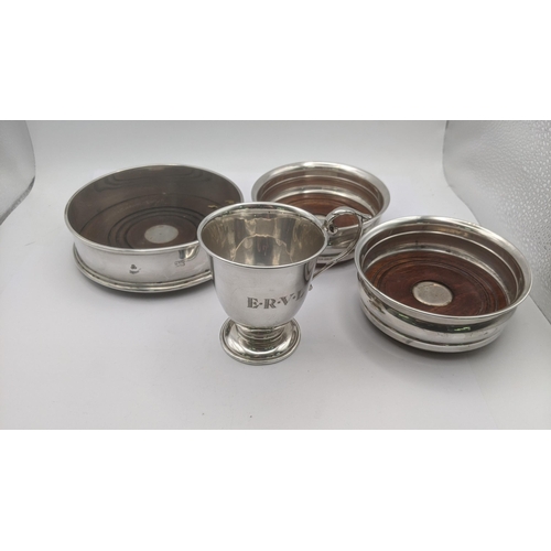 118 - A mixed lot of silver to include three wine coasters along with a christening cup engraved E.R.V.L h... 