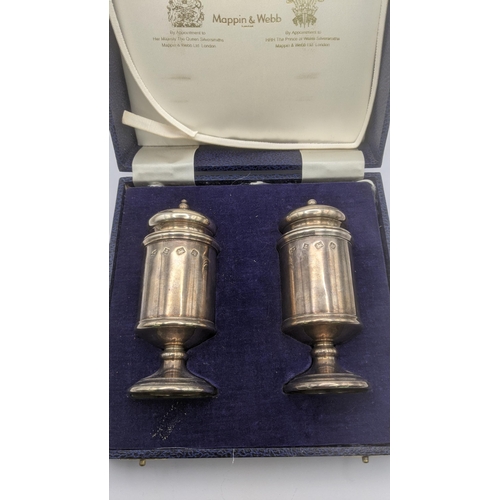 120 - A two-piece Mappin and Webb silver pedestal pepper and salt pot hallmarked Birmingham 1982 in a fitt... 