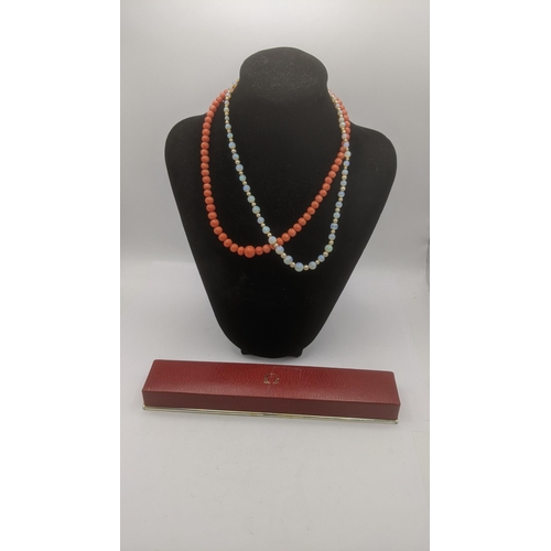 143 - A graduated coral beaded necklace with a 9ct yellow gold clasp together with an opal and pearl style... 