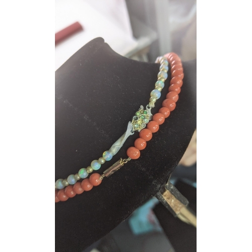 143 - A graduated coral beaded necklace with a 9ct yellow gold clasp together with an opal and pearl style... 