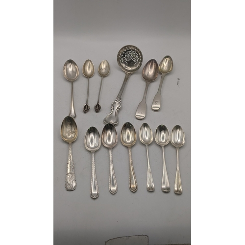 15 - Silver comprising of a sugar shifter a group of silver tea mixed tea spoons, along with two 800 silv... 