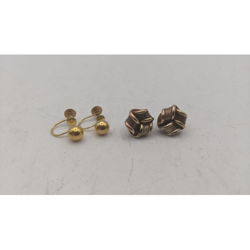 18 - Two pairs of 9ct yellow gold lady's earrings to include a pair of tricoloured knot style stud earrin... 