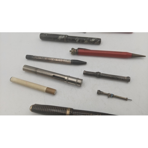 22 - Pens and propelling pencils to include a 1940s  Parker Vacumatic golden pearl fountain pen with Park... 