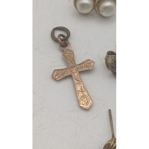 25 - Mixed 9ct yellow gold to include a crucifix pendant, a pair of earrings, and a heart shaped clasp an... 