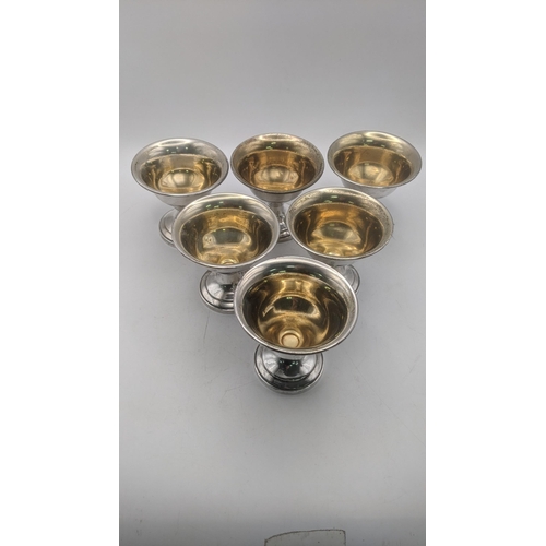 36 - A set of six sterling silver dwarf goblets with weighted bases and gilt interior
Location:ST
If ther... 