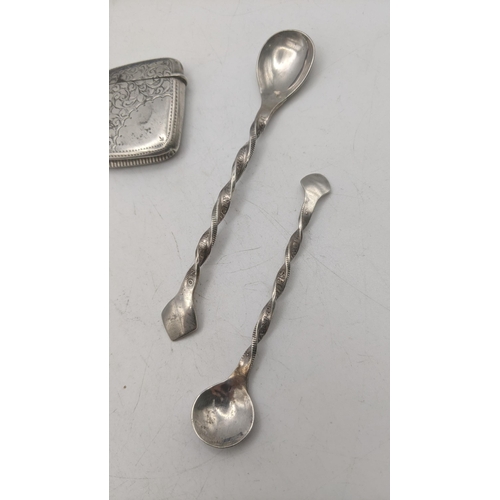 41 - Silver to include a vesta case a propelling pencil, two spoons the handles made from coins, and two ... 