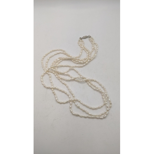 47 - A triple string irregular shaped pearl necklace on a white metal clasp 70cm L
Location:CAB5
If there... 