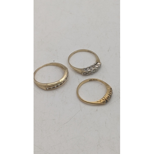 51 - Three ladies yellow gold rings to include an 18ct yellow gold diamond and blue sapphire ring 1.9g to... 