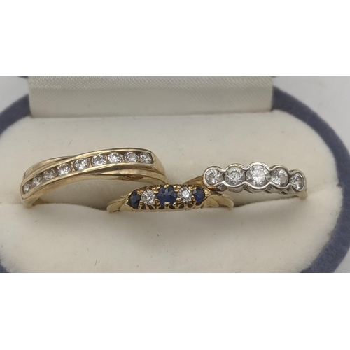 51 - Three ladies yellow gold rings to include an 18ct yellow gold diamond and blue sapphire ring 1.9g to... 