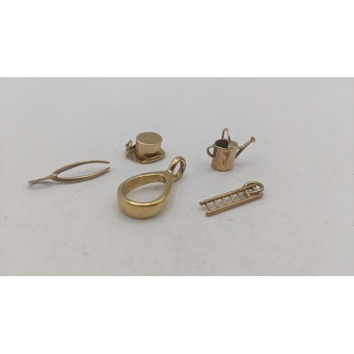 60 - Four 9ct yellow gold charm bracelets to include a wishbone, top hat, ladders and watering can 2.6g, ... 